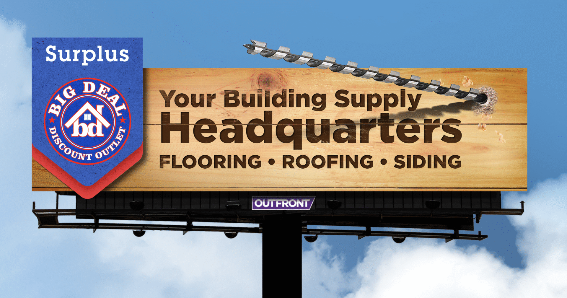 Billboard advertising a building supply headquarters for flooring, roofing, and siding.